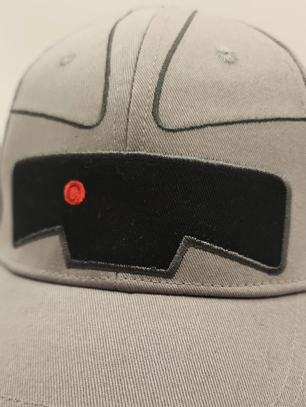 Gray Baseball Cap with Black Patch and Red Accent